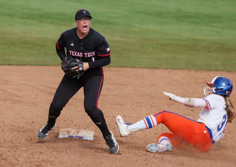 Texas Tech second baseman Mia Williams (1) gets Florida infielder Kenleigh Cahalan (31) out at second during game 3 of the super regional of the NCAA Division 1 softball championship at Katie Seashole Pressly Stadium in Gainesville, FL on Sunday, May 24, 2026. [Alan Youngblood/Gainesville Sun]