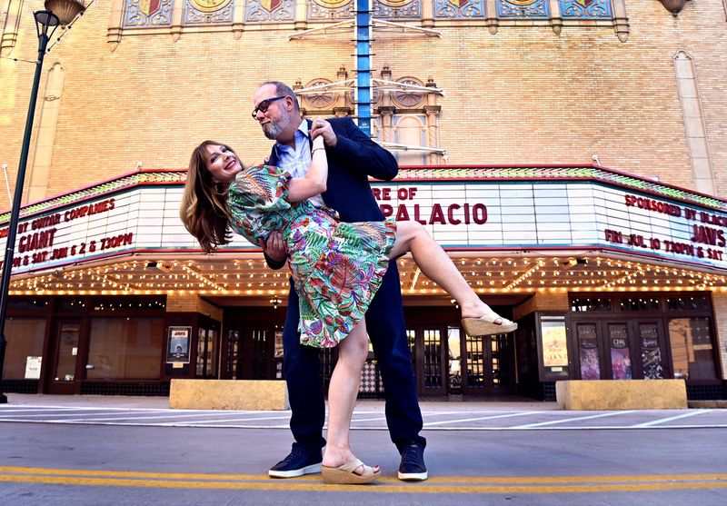 George Levesque dips his wife Sidney in front of the Paramount Theatre marquee May 24. George is the theater’s executive director while Sidney is the marketing director for the Abilene Cultural Affairs Council. Their family is moving to Florida where George will start as the Tampa Theatre’s executive director June 10.