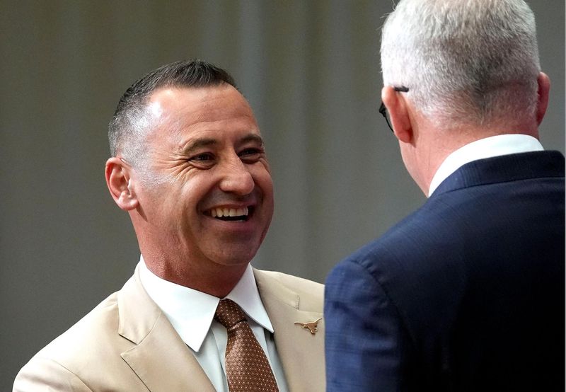 Texas head coach Steve Sarkisian shakes hands with Commissioner Greg Sankey during SEC Media Days at the College Football Hall of Fame in Atlanta.