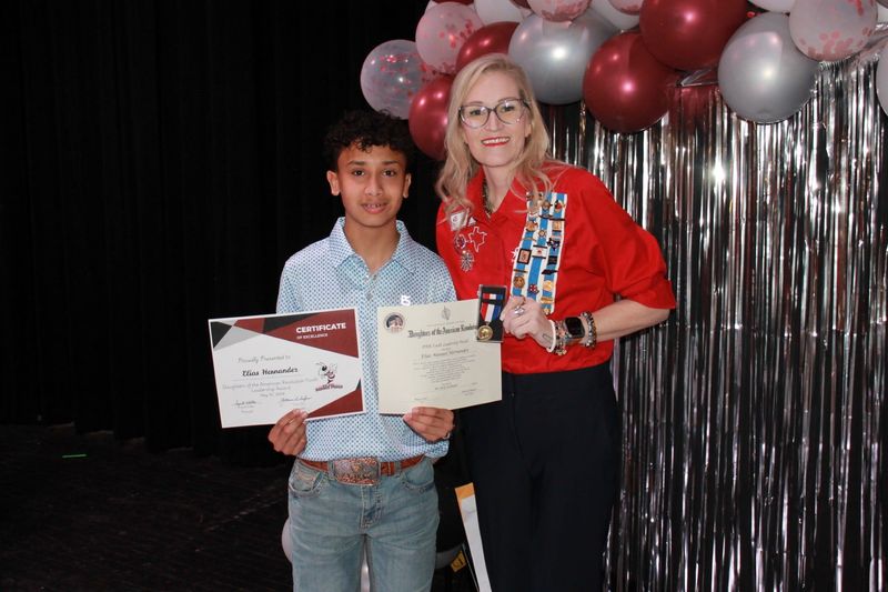 Tulia Junior High student Elias Manuel Hernandez is presented with a Youth Leadership Medal at a ceremony by Sherrel Reeser, Molly Goodnight Chapter regent.
