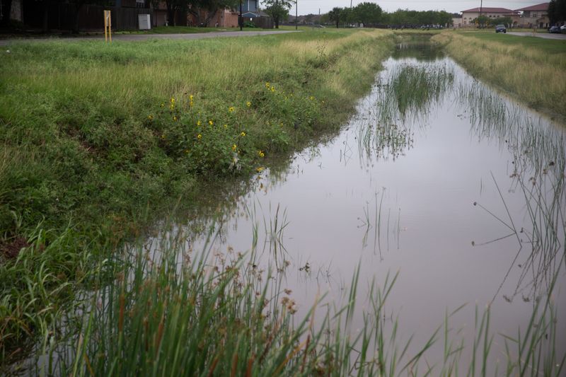 A runoff from Oso Bay near Edinburg Circle shows an increase of heavy rain effects in Corpus Christi, Texas, on May 27, 2026.
