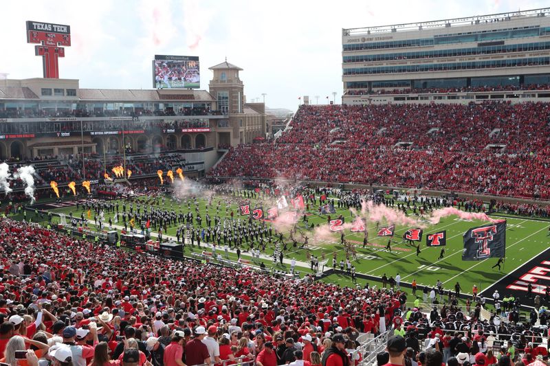 Oct 25, 2025; Lubbock, Texas, USA; A general view of the Texas Tech Red Raiders entering the field before the game against the Oklahoma State Cowboys at Jones AT&T Stadium. Mandatory Credit: Michael C. Johnson-Imagn Images