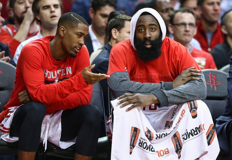 Apr 5, 2017; Houston, TX, USA; Houston Rockets guard Isaiah Taylor (left) talks with guard James Harden (right) on the bench during the second quarter against the Denver Nuggets at Toyota Center. Mandatory Credit: Troy Taormina-USA TODAY Sports