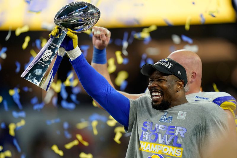 Los Angeles Rams outside linebacker Von Miller (40) raises the Vince Lombardi Trophy after Super Bowl 56 between the Cincinnati Bengals and the Los Angeles Rams at SoFi Stadium in Inglewood, Calif., on Sunday, Feb. 13, 2022. The Rams came back in the final minutes of the game to win 23-20 on their home field.

Super Bowl 56 Cincinnati Bengals Vs La Rams