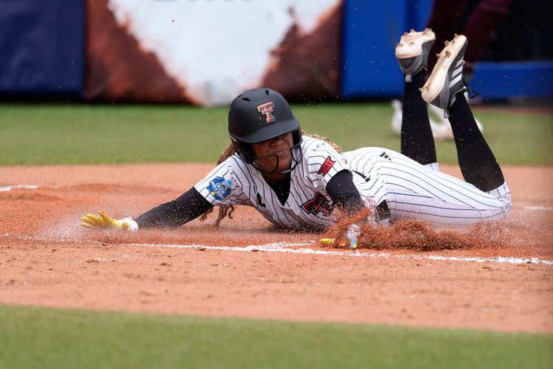 Texas Tech Red Raiders outfielder Mihyia Davis (42) slides home t score a run in the second inning of a Women's College World Series softball game between the Texas Tech Red Raiders and the Mississippi State Bulldogs at Devon Park in Oklahoma City, Thursday, May 28, 2026.