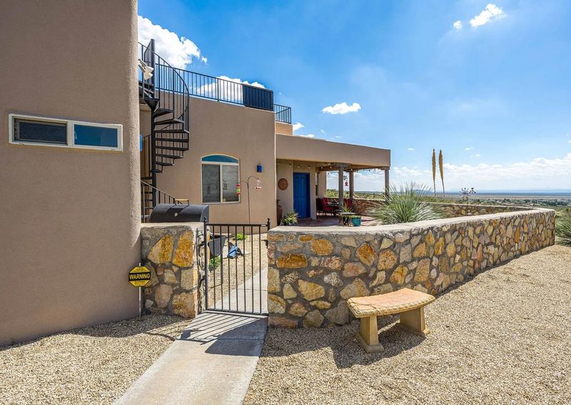With a commanding hilltop location, the home at 15514 Space Murals Lane, stretches across five acres and is backed by the Organ Mountains–Desert Peaks National Monument.