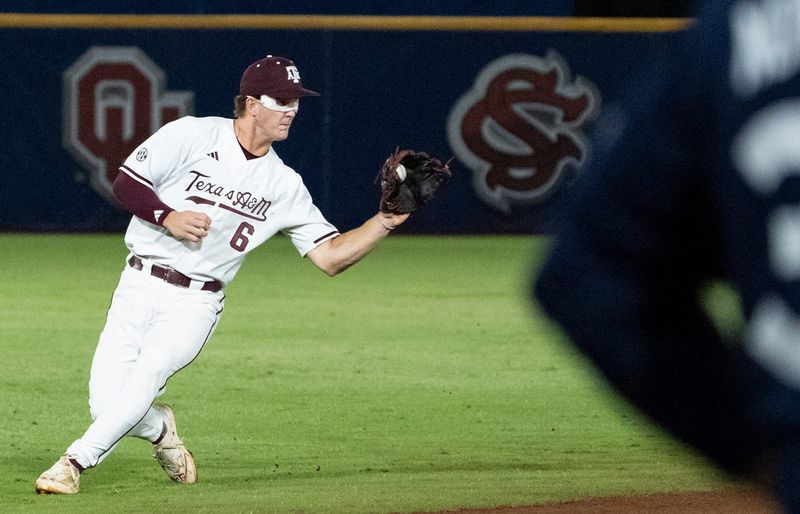 Texas A&M Aggies' Boston Kellner (6) fields a bouncing ground ball as Auburn Tigers take on Texas A&M Aggies during the SEC baseball tournament at Hoover Metropolitan Stadium in Hoover, Ala. on Friday, May 22, 2026.