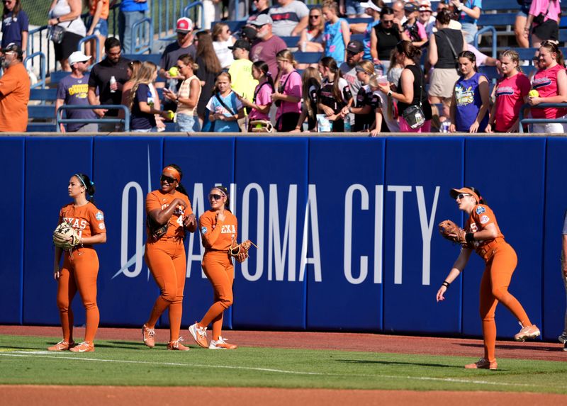 Texas warms up before during a Women's College World Series softball game between the Mississippi State Bulldogs and the Texas Longhorns at Devon Park in Oklahoma City, May 29, 2026.