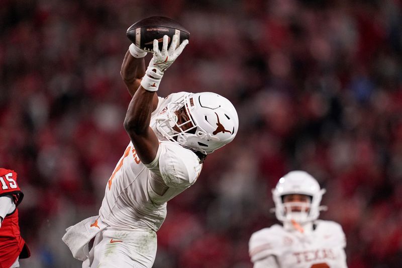 Nov 15, 2025; Athens, Georgia, USA; Texas Longhorns wide receiver Ryan Wingo (1) attempts to make a catch in the second half against the Georgia Bulldogs at Sanford Stadium. Mandatory Credit: Dale Zanine-Imagn Images