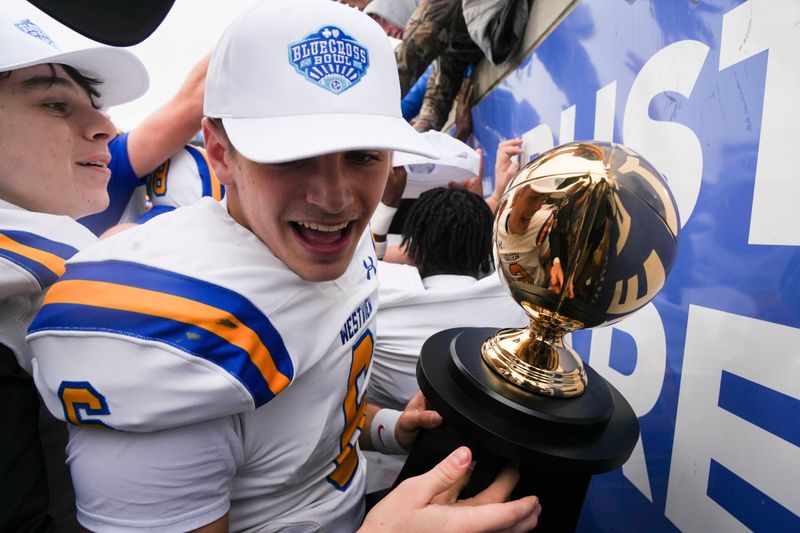 Westview's Graham Simpson (6) with the Class 3A Championship trophy in Finley Stadium, Chattanooga, Tenn., on Friday, Dec. 5, 2025.
