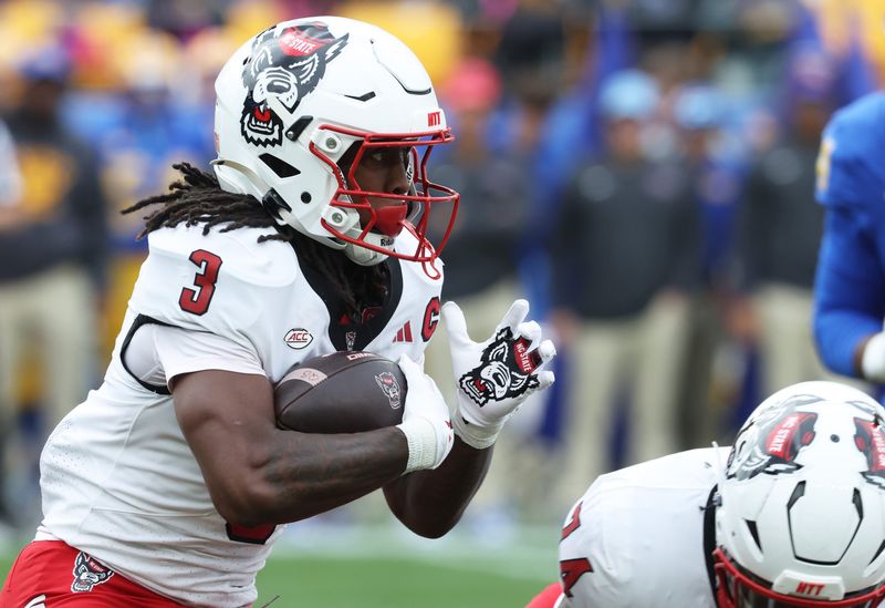 Oct 25, 2025; Pittsburgh, Pennsylvania, USA; North Carolina State Wolfpack running back Hollywood Smothers (3) runs the ball against the Pittsburgh Panthers during the first quarter at Acrisure Stadium. Mandatory Credit: Charles LeClaire-Imagn Images