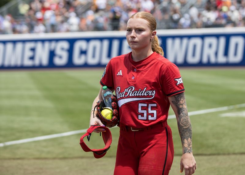 May 30, 2026; Oklahoma City, OK, USA; Texas Tech Red Raiders pitcher Kaitlyn Terry (55) walks to the dugout after warming up before the game against the Tennessee Lady Volunteers during the NCAA Women’s College World Series at Devon Park. Mandatory Credit: Brett Rojo-Imagn Images