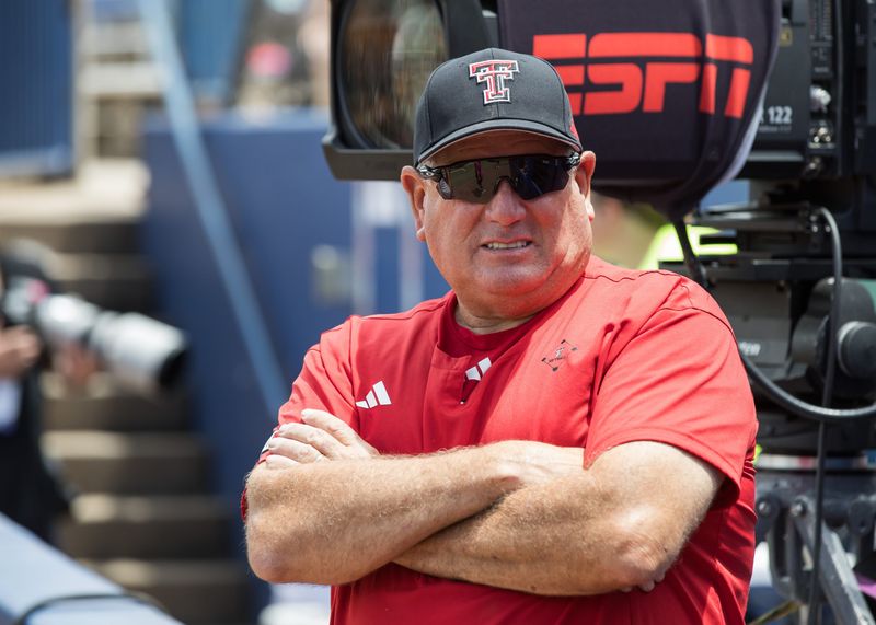 May 30, 2026; Oklahoma City, OK, USA; Texas Tech Red Raiders head coach Gerry Glasco watches warmups before the game against the Tennessee Lady Volunteers during the NCAA Women’s College World Series at Devon Park. Mandatory Credit: Brett Rojo-Imagn Images