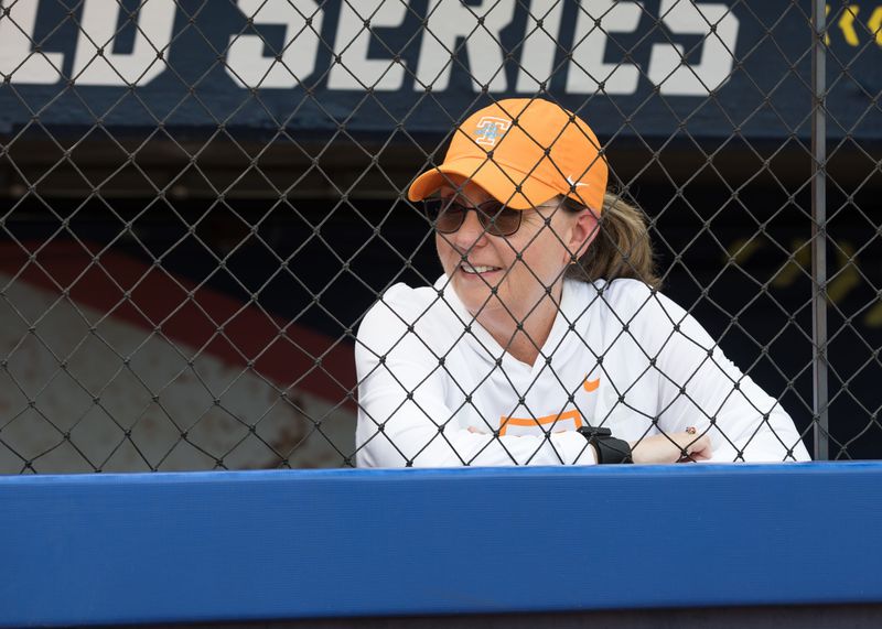 May 30, 2026; Oklahoma City, OK, USA; Tennessee Lady Volunteers head coach Karen Weekly looks on from the dugout during warmups before the game against the Texas Tech Red Raiders during the NCAA Women’s College World Series at Devon Park. Mandatory Credit: Brett Rojo-Imagn Images