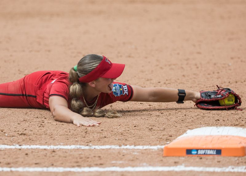 May 30, 2026; Oklahoma City, OK, USA; Texas Tech Red Raiders infielder Jackie Lis (00) reacts after making a catch while colliding with the Tennessee Lady Volunteers infielder Emma Clarke (not pictured) in the third inning during the NCAA Women’s College World Series at Devon Park. Mandatory Credit: Brett Rojo-Imagn Images