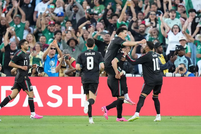 May 30, 2026; Pasadena, California, USA; Mexico centre back Johan Vasquez (5) celebrates with right wing back Jorge Sanchez (2), midfielder Alvaro Fidalgo (8), left midfielder Alexis Vega (10) and right midfielder Orbelin (17) after scoring a goal against Australia in the first half at Rose Bowl Stadium.