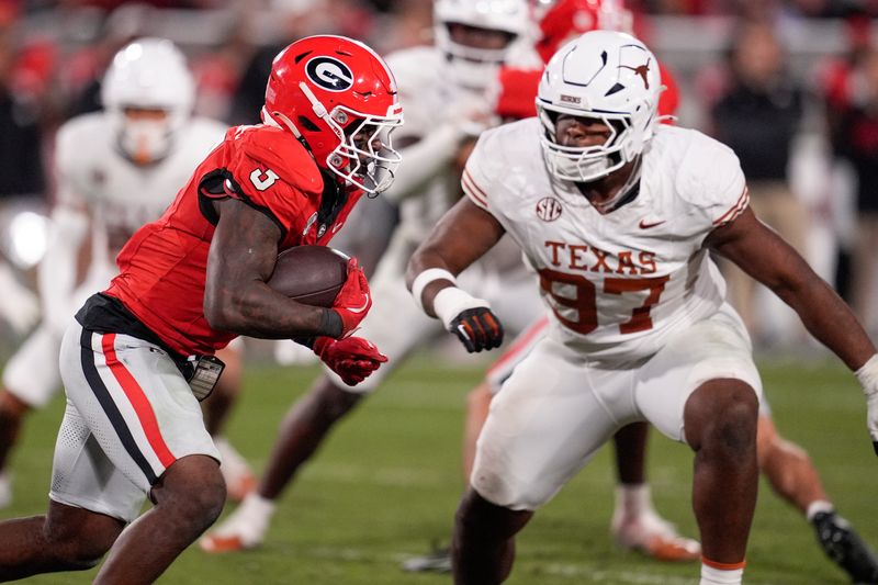 Nov 15, 2025; Athens, Georgia, USA; Georgia Bulldogs running back Nate Frazier (3) runs the ball against Texas Longhorns defensive lineman Alex January (97) in the second half at Sanford Stadium. Mandatory Credit: Dale Zanine-Imagn Images