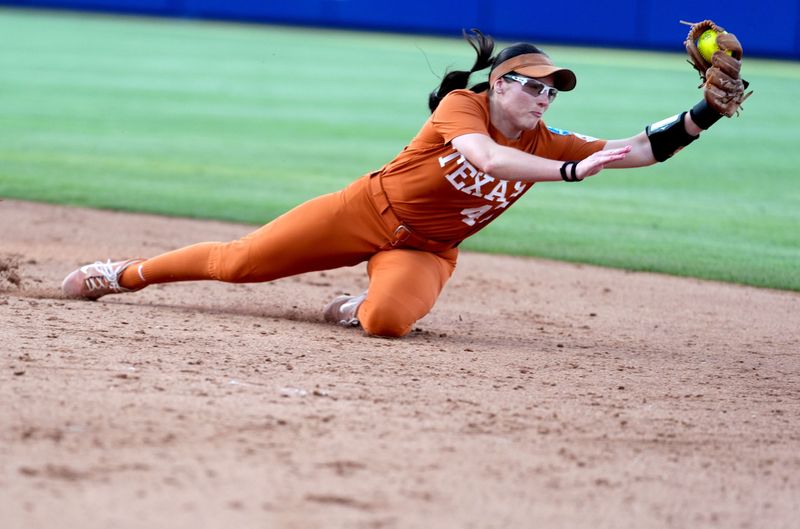 Texas' Leighann Goode (43) makes a diving catch in the sixth inning during a Women's College World Series softball game between the Mississippi State Bulldogs and the Texas Longhorns at Devon Park in Oklahoma City, May 29, 2026.