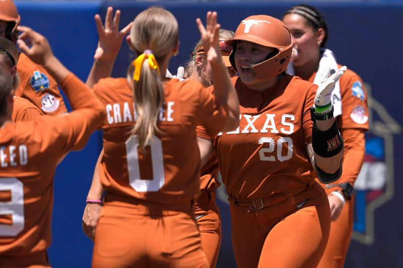 Texas Longhorns utility Katie Stewart (20) celebrates after hitting a home run in the fifth inning of a Women's College World Series softball game between the University of Texas Longhorns and the Tennessee Lady Volunteers at Devon Park in Oklahoma City, Monday, June 1, 2026.