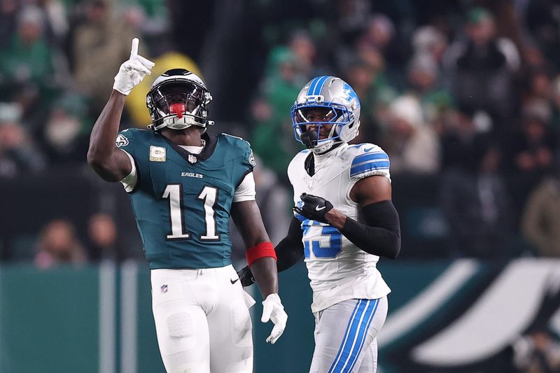 Nov 16, 2025; Philadelphia, Pennsylvania, USA; Philadelphia Eagles wide receiver A.J. Brown (11) reacts after making a catch against Detroit Lions cornerback Rock Ya-Sin (23) during the first half at Lincoln Financial Field. Mandatory Credit: Bill Streicher-Imagn Images