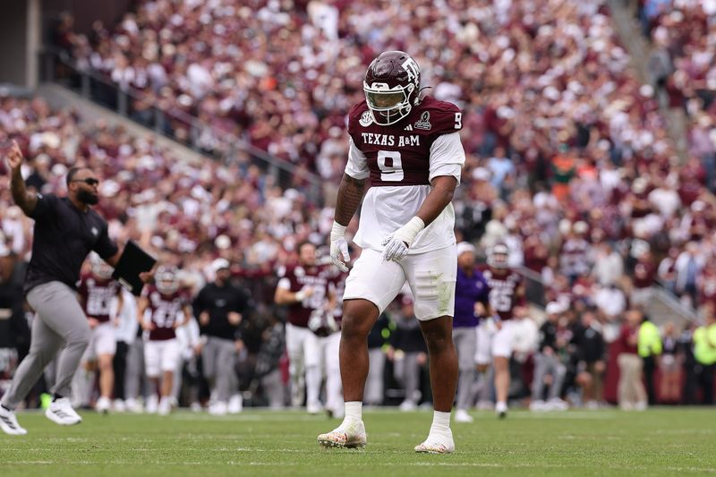 Dec 20, 2025; College Station, TX, USA; Texas A&M Aggies defensive end Cashius Howell (9) reacts during first half of the first round game of the CFP National Playoff against the Miami Hurricanes at Kyle Field. Mandatory Credit: Maria Lysaker-Imagn Images