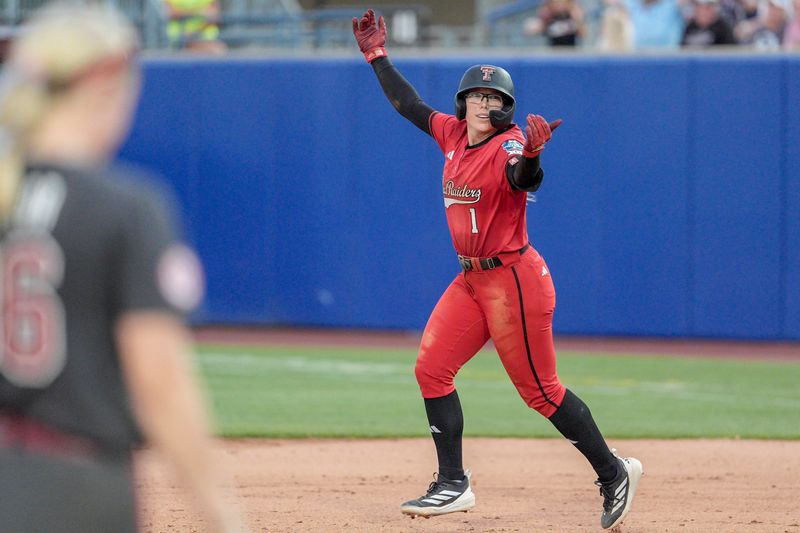Texas Tech second baseman Mia Williams (1) hits a home run to end the game in the seventh inning during a softball game at the Women’s College World Series between Texas Tech and Alabama at Devon Park in Oklahoma City, on Monday, June 1, 2026.