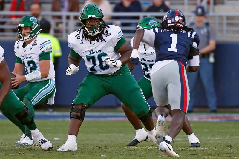 Dec 20, 2025; Oxford, MS, USA; Tulane Green Wave offensive lineman Derrick Graham (76) blocks during the first quarter against the Mississippi Rebels at Vaught-Hemingway Stadium. Mandatory Credit: Petre Thomas-Imagn Images