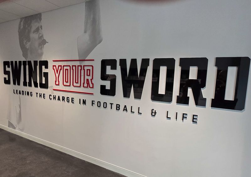 Signage honoring the late Mike Leach adorns a wall inside Texas Tech's new Womble Football Center is seen on Thursday, March 6, 2025.