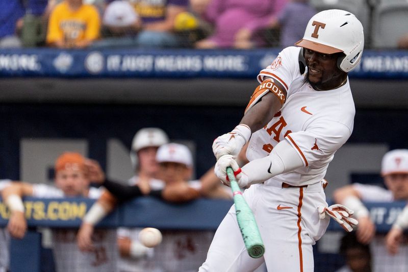 Texas Longhorns' Dariyan Pendergrass (42) swings at the ball as Arkansas Razorbacks take on Texas Longhorns during the SEC baseball tournament at Hoover Metropolitan Stadium in Hoover, Ala. on Friday, May 22, 2026.