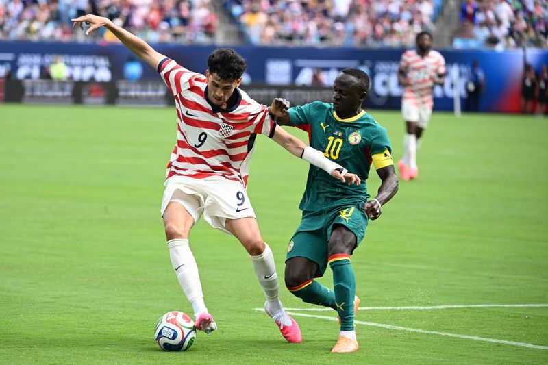May 31, 2026; Charlotte, North Carolina, USA; United States forward Ricardo Pepi (9) with the ball as Senegal forward Sadio Mane (10) defends in the first half at Bank of America Stadium. Mandatory Credit: Bob Donnan-Imagn Images