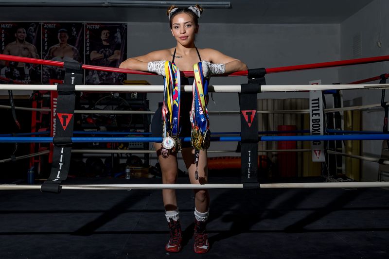 El Paso boxer and former amateur star Kayla Gomez poses for a portrait with medals she won during her amateur career Wednesday, June 3, 2026, at Bloodline Boxing Academy in El Paso, Texas. Gomez is preparing for her professional debut June 19 in California.