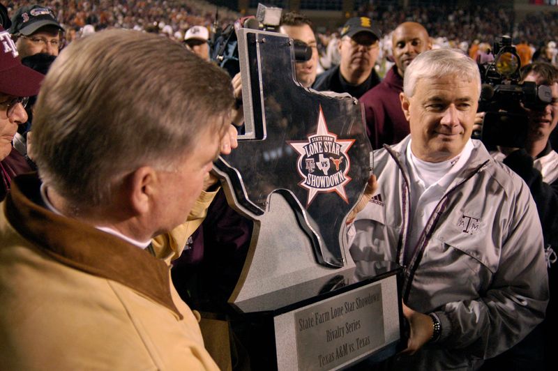 Nov 23, 2007; College Station, TX, USA; Texas A&M Aggies Head Coach Dennis Franchione accepts the Lone Star Showdown Trophy after the game against the Texas Longhorns at Kyle Field. Texas A&M beat Texas 38-30. Mandatory Credit: Brett Davis-USA TODAY Sports