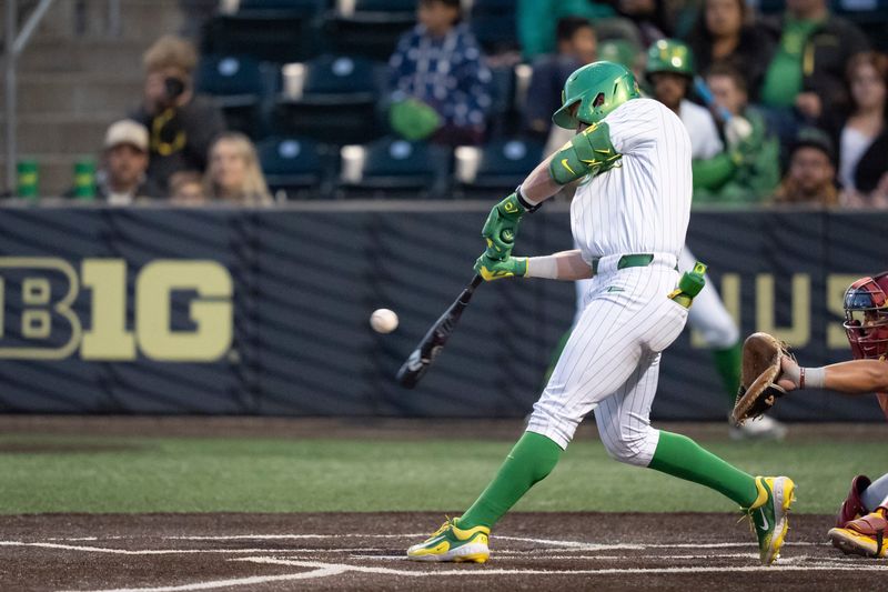 Oregon infielder Ryan Cooney hits a single as the Oregon Ducks host the USC Trojans on May 14, 2026, in Eugene, Oregon.
