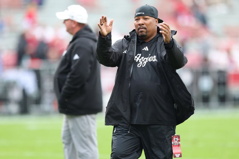 Oct 18, 2025; Fayetteville, Arkansas, USA; Texas A&M Aggies associate head coach Trooper Taylor during warmups prior to the game against the Arkansas Razorbacks at Donald W. Reynolds Razorback Stadium. Mandatory Credit: Nelson Chenault-Imagn Images