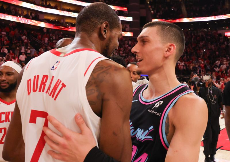 Mar 21, 2026; Houston, Texas, USA; Mar 21, 2026; Houston, Texas, USA; Miami Heat guard Tyler Herro (14) congratulates Houston Rockets forward Kevin Durant (7) on passing Michael Jordan record after playing at Toyota Center. Mandatory Credit: Thomas Shea-Imagn Images