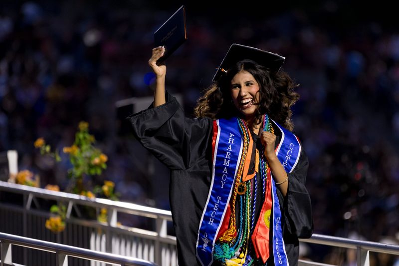 An El Paso High School graduate celebrates after receiving a diploma during the school's commencement ceremony Friday, June 5, 2026, at R.R. Jones Stadium in El Paso, Texas.