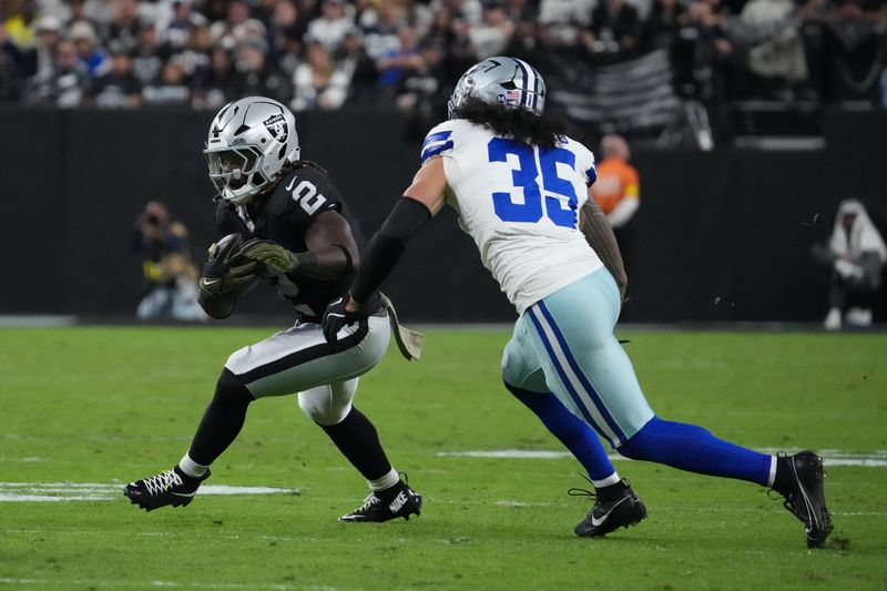 Nov 17, 2025; Paradise, Nevada, USA; Las Vegas Raiders running back Ashton Jeanty (2) runs after the catch as Dallas Cowboys linebacker Marist Liufau (35) defends during the first half at Allegiant Stadium. Mandatory Credit: Kirby Lee-Imagn Images