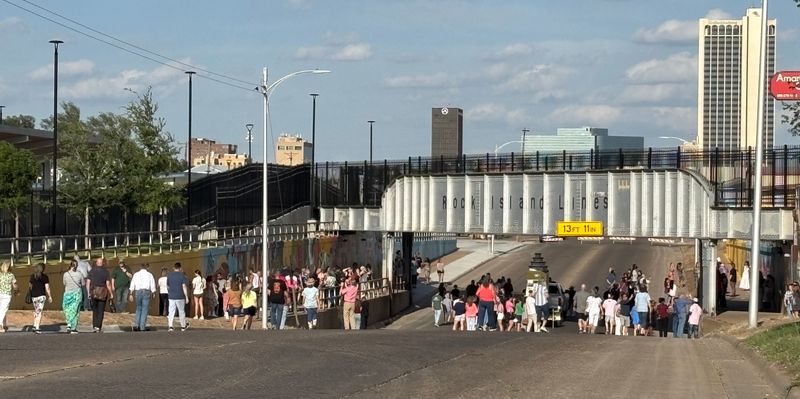 A crowd makes the long trek to the official unveiling of the “66 Stories from Route 66” 400-foot mural in Amarillo.