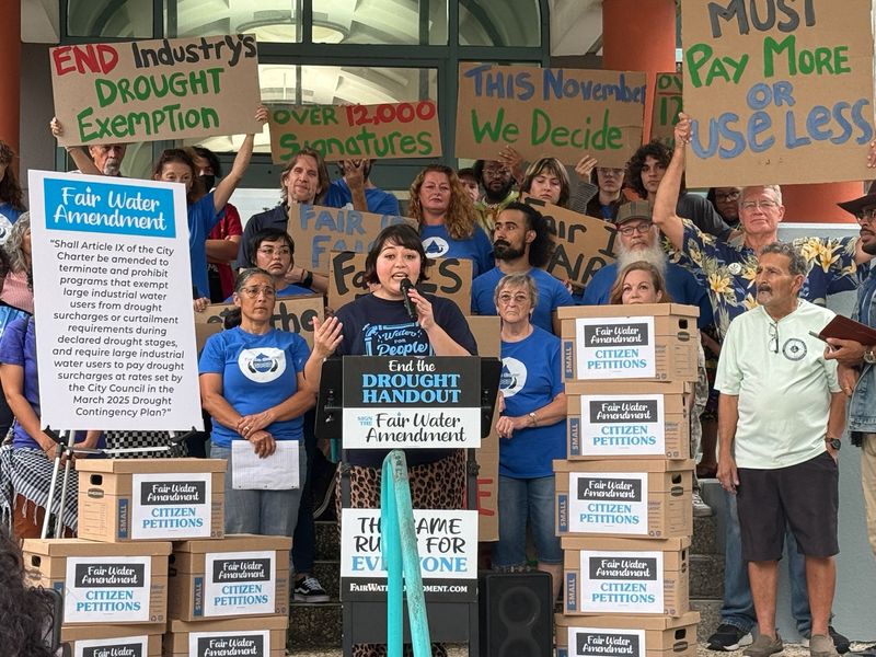 Chloe Torres, Texas Campaign for the Environment’s Coastal Bend regional coordinator, speaks at the podium during a news conference announcing the submission of a petition aimed at putting on the November ballot a "Fair Water Amendment."