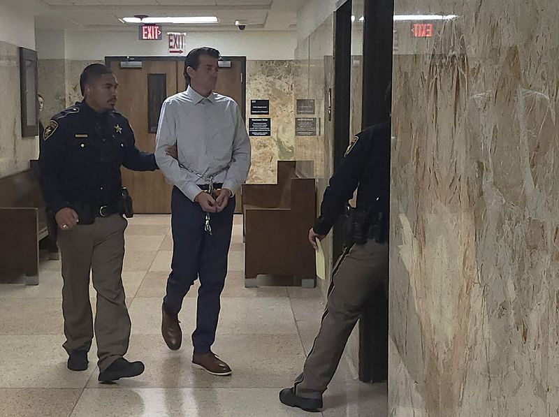 Pablo Hinojosa is escorted out of the 137th District courtroom where he was sentenced to 65 years in prison after jurors convicted him of counts of continuous sexual abuse of a child and aggravated sexual assault of a child.