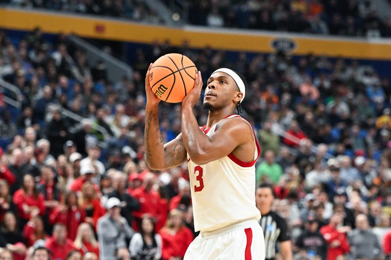 Mar 19, 2026; Buffalo, NY, USA; Louisville Cardinals guard Ryan Conwell (3) shoots a free throw during the first half against the South Florida Bullsduring a first round game of the men's 2026 NCAA Tournament at Keybank Center. Mandatory Credit: Mark Konezny-Imagn Images
