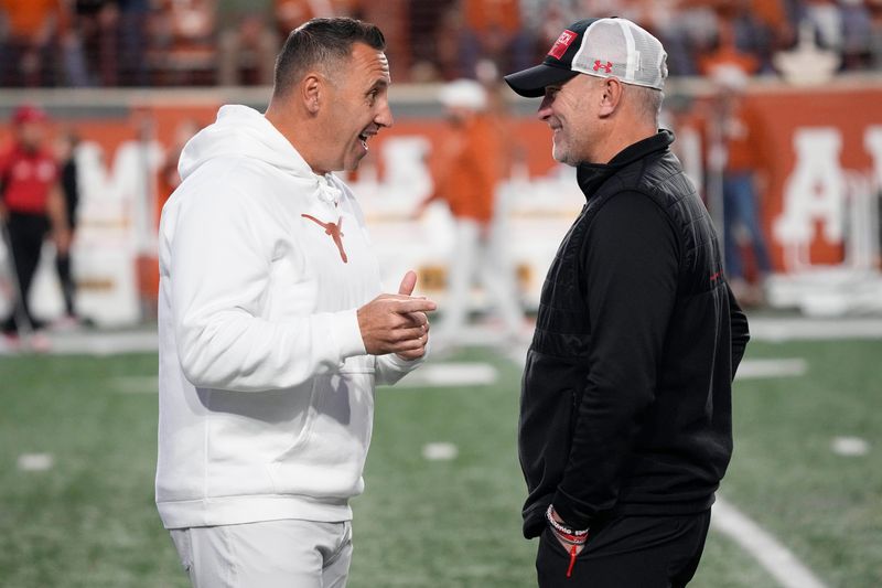 Nov 24, 2023; Austin, Texas, USA; Texas Longhorns head coach Steve Sarkisian talks with Texas Tech Red Raiders head coach Joey McGuire before the game at Darrell K Royal-Texas Memorial Stadium. Mandatory Credit: Scott Wachter-USA TODAY Sports