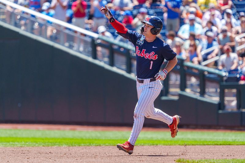 Jun 14, 2026; Omaha, NE, USA; Mississippi Rebels left fielder Brayden Randle (1) celebrates after hitting a two-run home run against the Troy Trojans during the second inning at Charles Schwab Field. Mandatory Credit: Dylan Widger-Imagn Images