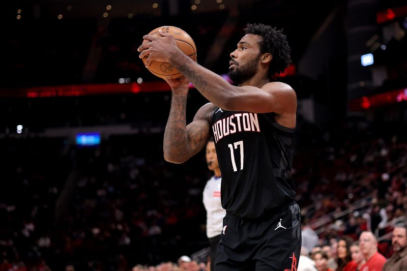 Jan 26, 2026; Houston, Texas, USA; Houston Rockets forward Tari Eason (17) shoots outside against the Memphis Grizzlies during the first quarter at Toyota Center. Mandatory Credit: Erik Williams-Imagn Images