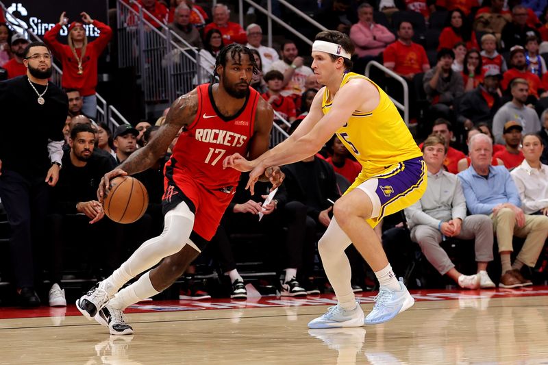 May 1, 2026; Houston, Texas, USA; Houston Rockets forward Tari Eason (17) handles the ball against Los Angeles Lakers guard Austin Reaves (15) during the second quarter of game six of the first round of the 2026 NBA Playoffs at Toyota Center. Mandatory Credit: Erik Williams-Imagn Images