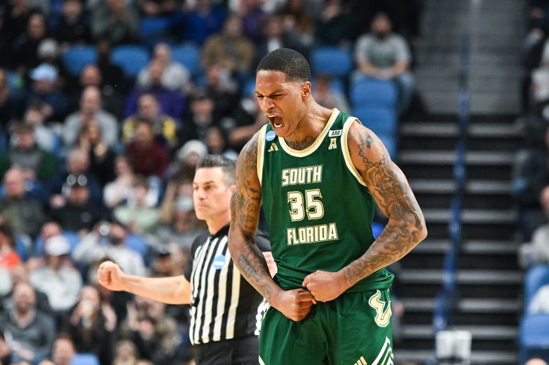 Mar 19, 2026; Buffalo, NY, USA; South Florida Bulls forward Izaiyah Nelson (35) reacts to a play during the first half against the Louisville Cardinals during a first round game of the men's 2026 NCAA Tournament at Keybank Center. Mandatory Credit: Mark Konezny-Imagn Images
