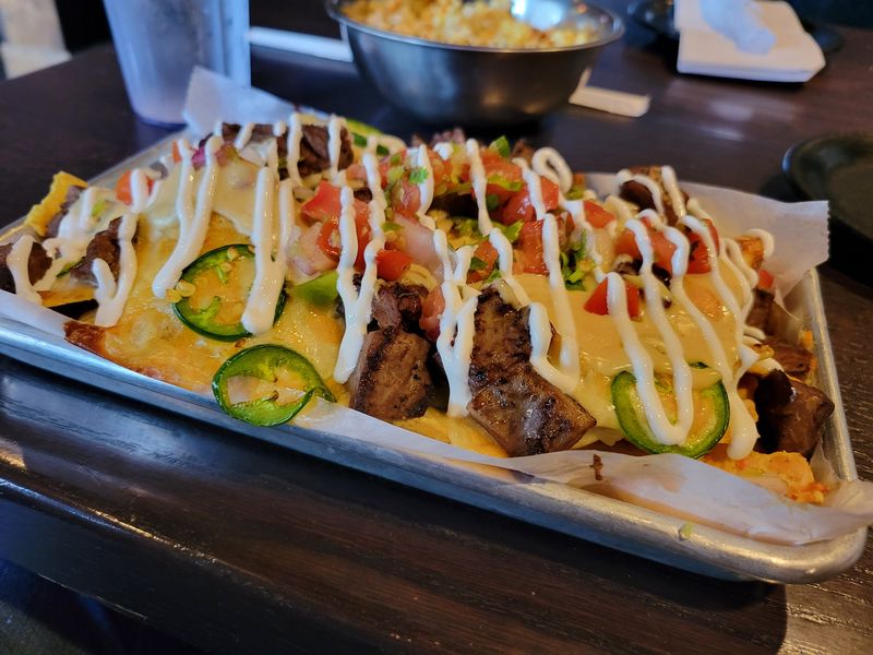 The Nacho Business with steak is on the menu, as seen on Thursday, June 18, 2026, at Flix Brewhouse, 120 W. Loop 289 Access Road, in Lubbock, Texas.