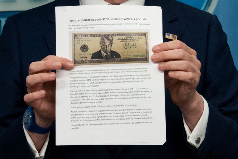 US Secretary of Treasury Scott Bessent shows a proposed $250 bill featuring President Donald Trump during a press briefing in the Brady Briefing Room of the White House in Washington, DC, on May 28, 2026.