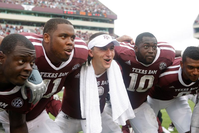 Sep 29, 2012; College Station, TX, USA; Texas A&M Aggies linebacker Steven Jenkins (45) and linebacker Jonathan Stewart (11) and quarterback Johnny Manziel (2) and linebacker Sean Porter (10) and wide receiver Nate Askew (9) and defensive lineman Damontre Moore (94) celebrate a victory against the Arkansas Razorbacks at Kyle Field. Texas A&M defeated Arkansas 58-10. Mandatory Credit: Brett Davis-USA TODAY Sports