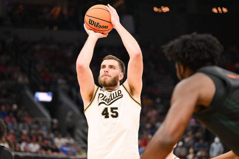 Mar 22, 2026; St. Louis, MO, USA; Purdue Boilermakers center Oscar Cluff (45) shoots a free throw during the second half against the Miami Hurricanes during a second round game of the men's 2026 NCAA Tournament at Enterprise Center. Mandatory Credit: Jeff Curry-Imagn Images
